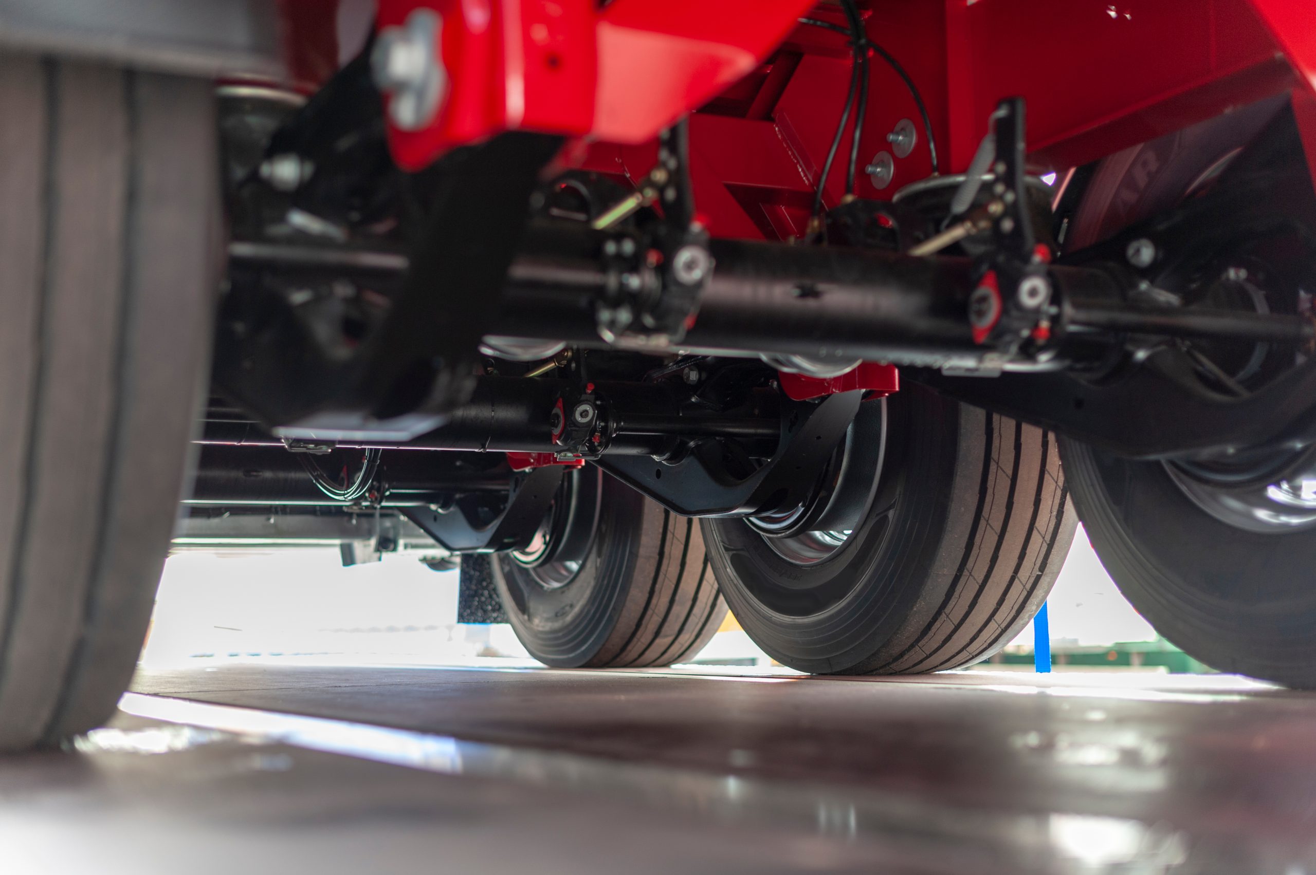 Underneath a semi truck showing axles