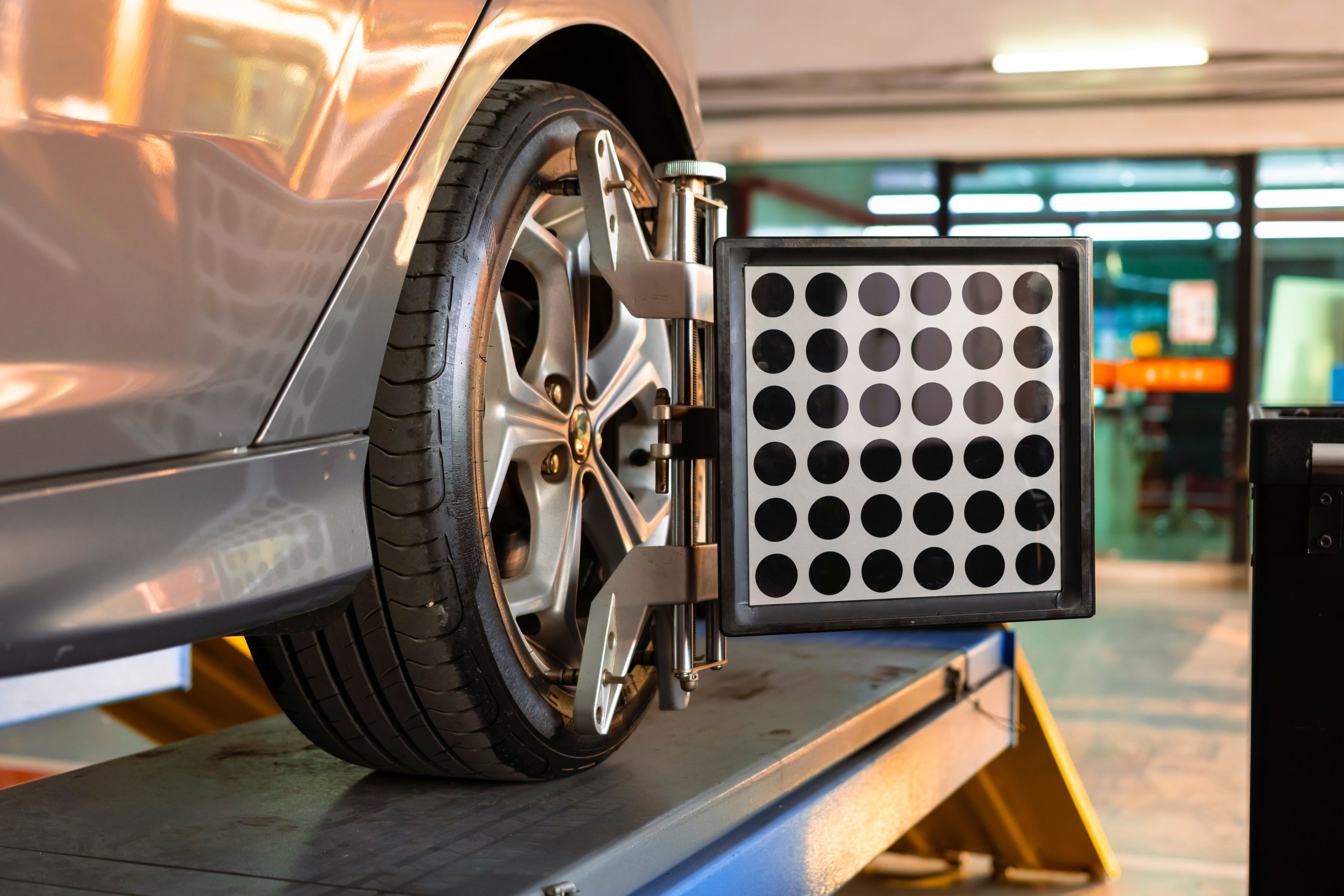 Car wheel alignment in progress using technology